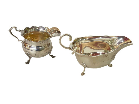Silver cream jug, Birmingham 1911, and silver sauce boat, Birmingham 1937...