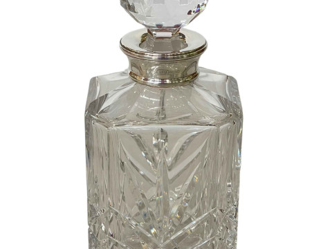 Silver collared crystal spirit decanter.