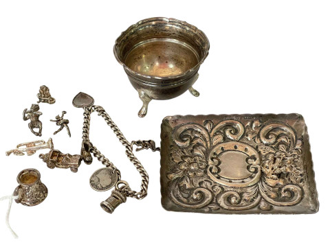 Silver salt, pin tray and charm bracelet.