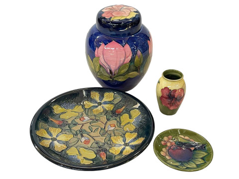 Four pieces of Moorcroft Pottery including Hypericum plate, 26.5cm diameter.