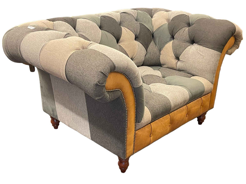Contemporary deep buttoned fabric, leather and studded Chesterfield chair, 80cm by 149cm by 100cm.
