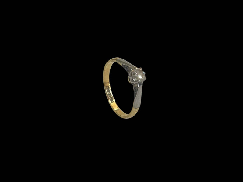 Diamond solitaire 18 carat gold and platinum set ring, size J.