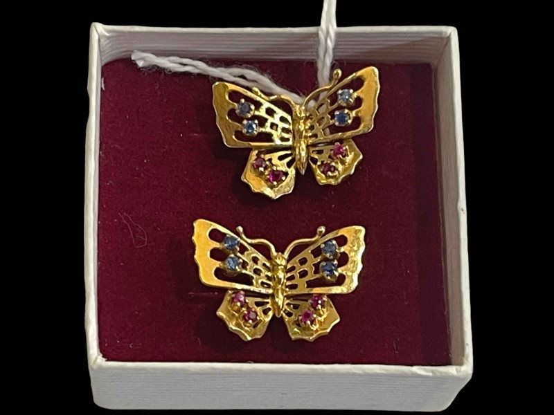 18 carat gold butterfly earrings set with sapphire and rubies.