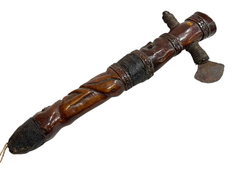 Carved wood tribal axe.