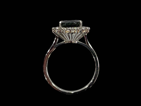 18 carat white gold claw set oval sapphire and diamond cluster ring, sapphire 3.90 carats, diamonds 0.50 carats. thumbnail