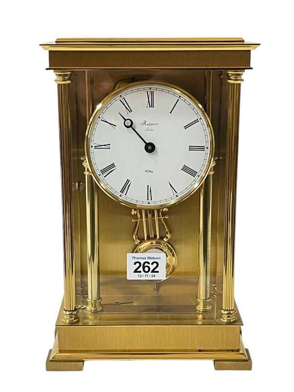 Rapport brass four pillar mantel clock with enamel dial.