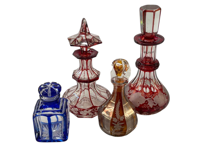 Four antique overlay glass scent bottles.