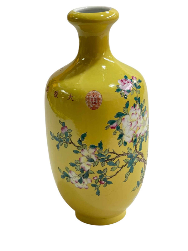 Chinese vase decorated with bird on branch on yellow ground with four character mark, 24cm.