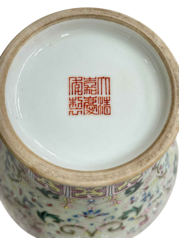 Chinese Famille Rose vase with bird and floral decoration with iron red mark to base, 29cm.