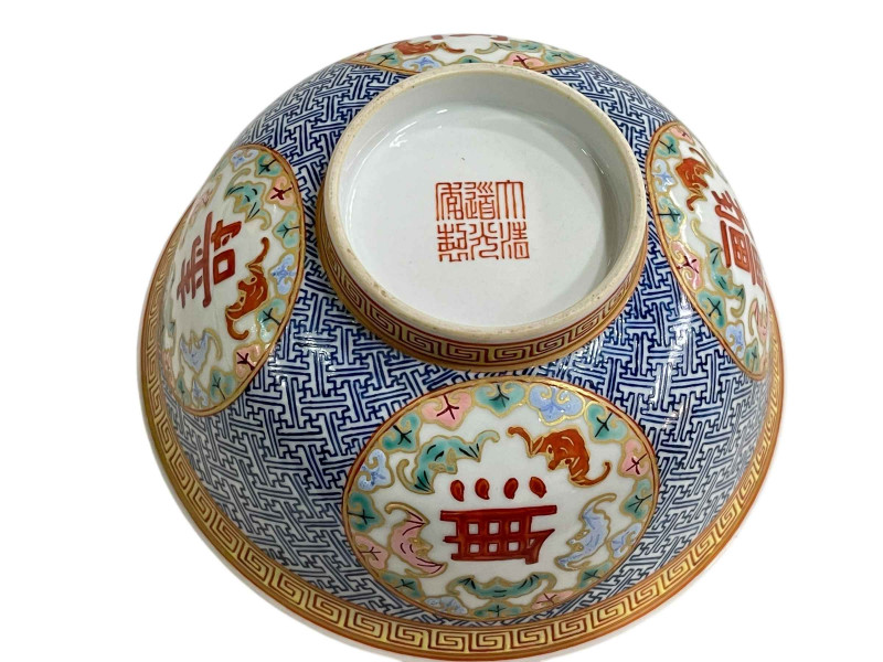 Small Chinese bowl with blue and white geometric and floral panel design, red seal mark to base, 15cm.