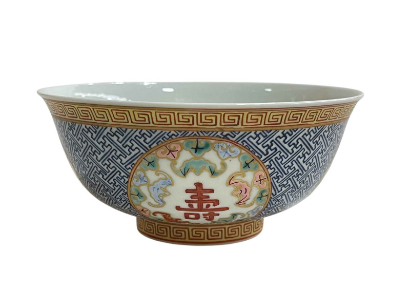 Small Chinese bowl with blue and white geometric and floral panel design, red seal mark to base, 15cm.
