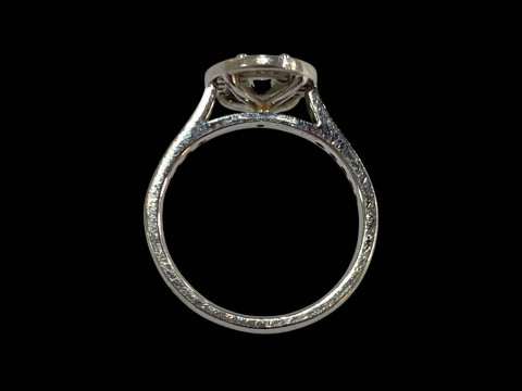 Platinum and diamond cluster ring, the central oval diamond 0.48 carats bordered by sixteen brilliant cut diamonds and further fourteen set into the shoulders, total diamond weight 0.90 carats, size K. thumbnail