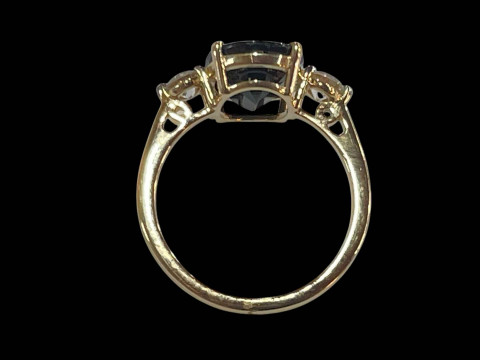 Sapphire and diamond three stone ring set in 18 carat yellow gold, the oval sapphire 2.75 carats flanked by diamonds totalling 0.38 carats, size L. thumbnail