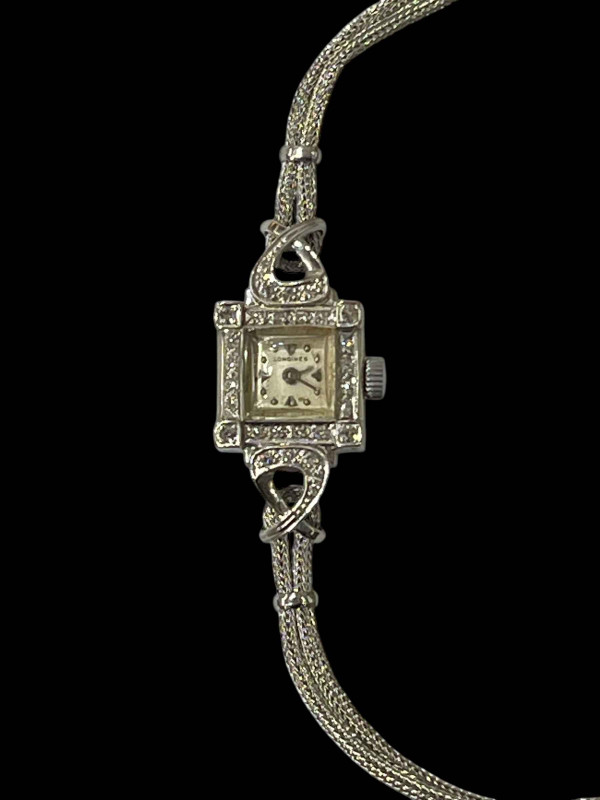Longines 14k white gold bracelet watch.