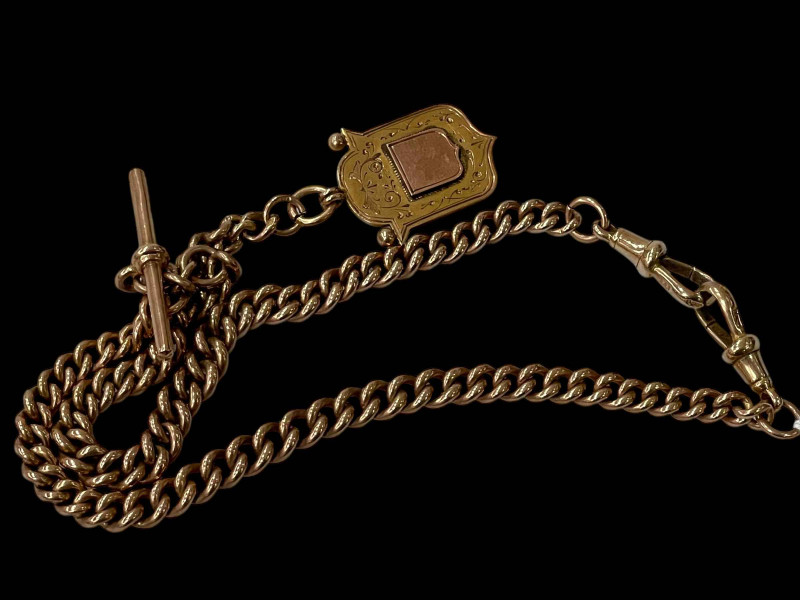9 carat gold double albert with medallion.