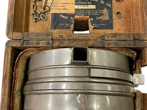 Pigeon timing clock in carrying case, bearing label for repair in May 1949, together with four pigeon racing books. thumbnail