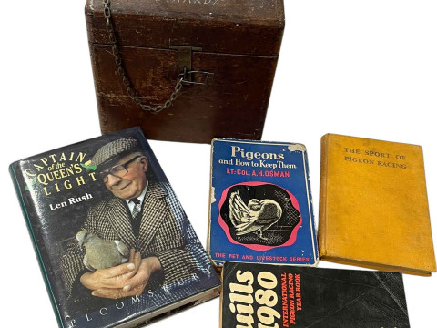 Pigeon timing clock in carrying case, bearing label for repair in May...