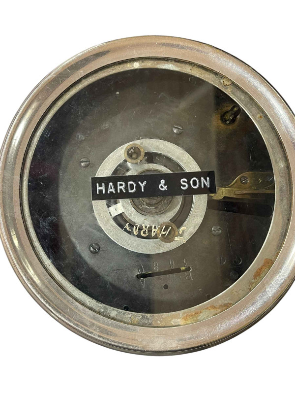 Pigeon timing clock in carrying case, bearing label for repair in May 1949, together with four pigeon racing books.