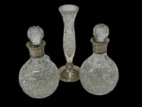 Pair of cut glass decanters with silver collars and similar vase with...