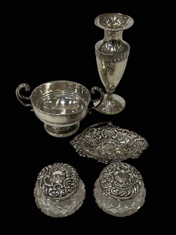 Silver urn shaped vase, small pierced silver basket, two handled silver pedestal bowl and pair of silver topped glass jars.