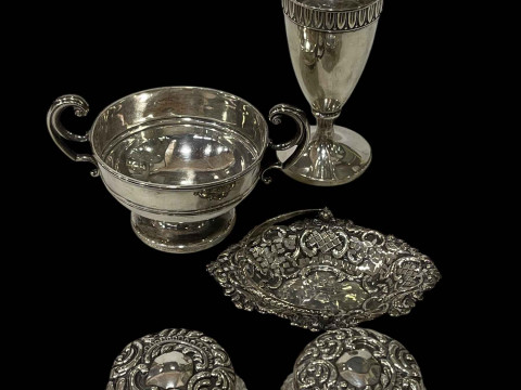 Silver urn shaped vase, small pierced silver basket, two handled silver...