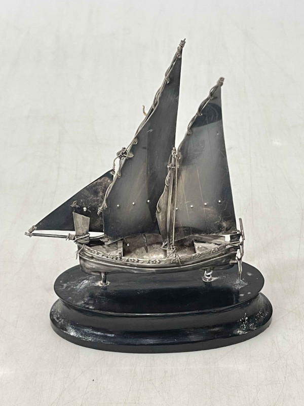 Sterling silver model of a masted sailing ship on ebonised base.