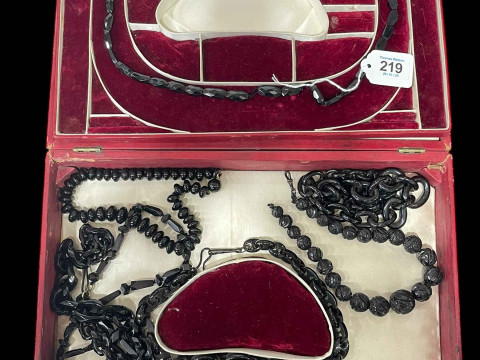 Collection of jet necklaces and bracelets.