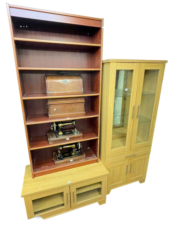 Contemporary light oak illuminated display cabinet and matching two door entertainment unit together with an open bookcase having one fixed and four adjustable shelves (3).