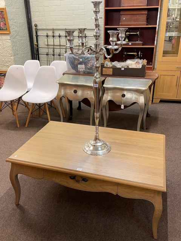Rectangular two drawer low centre table, 46cm by 114cm by 73cm and a five branch candelabra (2).