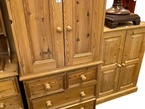 Pine entertainment cabinet having two doors above four drawers and pine...