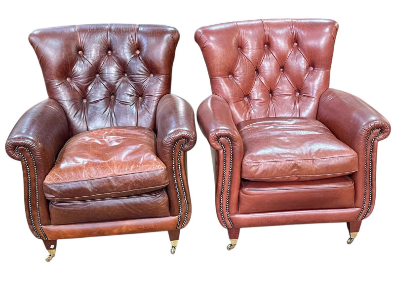 Pair brown button backed leather and brass studded armchairs.