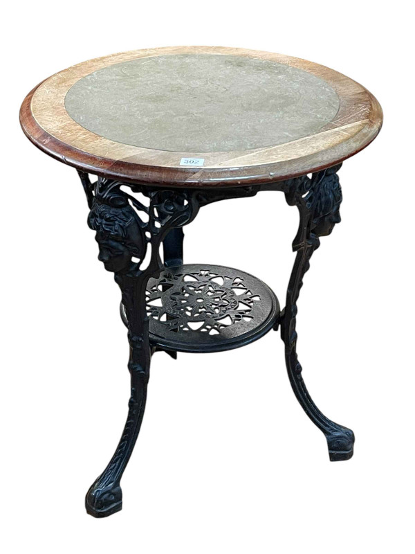Circular cast base pub table, 70cm by 58cm diameter.