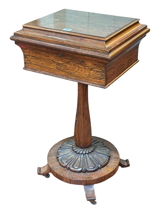 Victorian rosewood work table on hexagonal pedestal to circular quadriform base, 82cm by 46cm by 39.5cm.