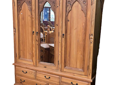 Pine combination wardrobe having central mirror door flanked by two arched...