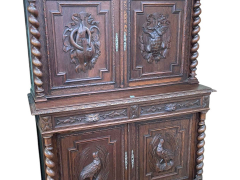 Victorian Continental carved oak hunters cabinet having four carved panel...