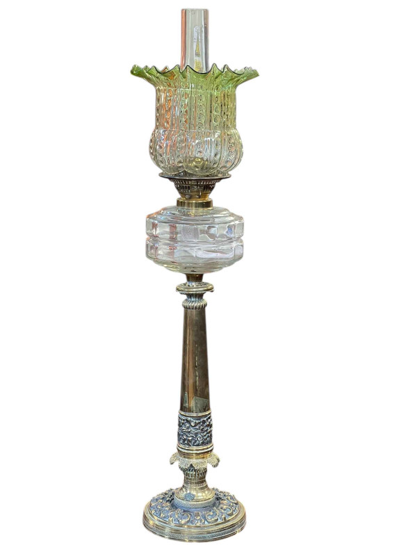 Victorian ornate brass column oil lamp with clear glass reservoir and vaseline shade, 81cm.