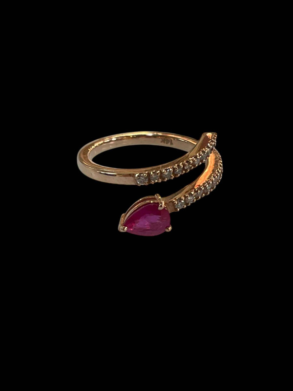 14 carat yellow gold, ruby and diamond snake design half eternity ring, size O.