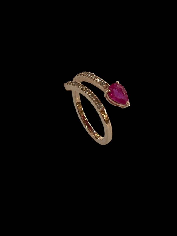 14 carat yellow gold, ruby and diamond snake design half eternity ring, size O.