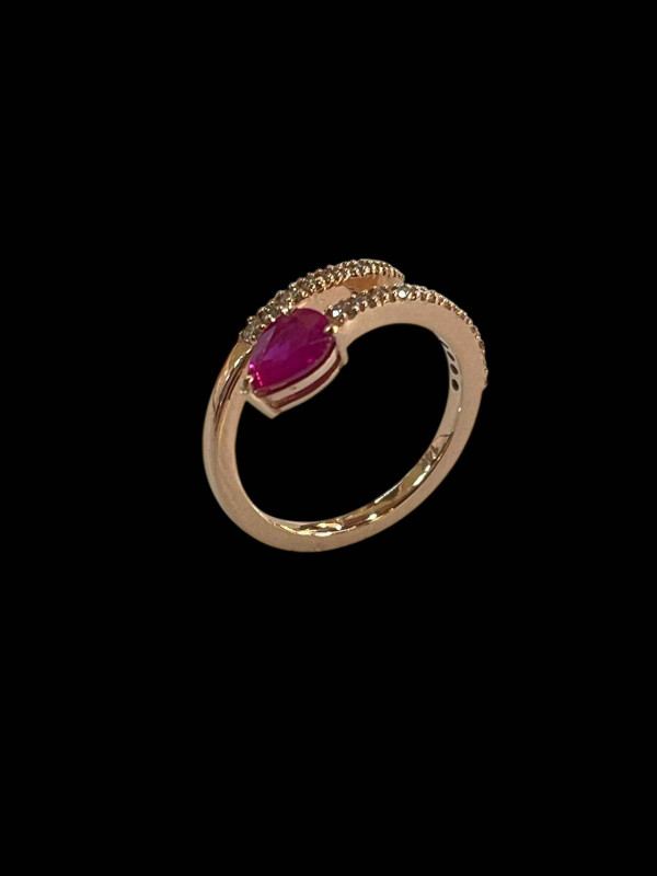 14 carat yellow gold, ruby and diamond snake design half eternity ring, size O.