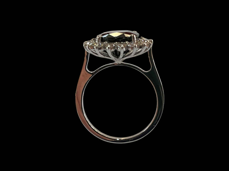 18 carat white gold, sapphire and diamond cluster ring, the sapphire over 5.5 carats, size M.