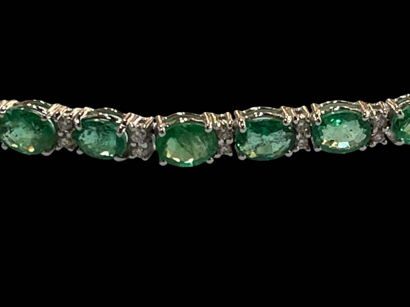 18 carat white gold, emerald and diamond bracelet, the emeralds totalling 7.70 carats.
