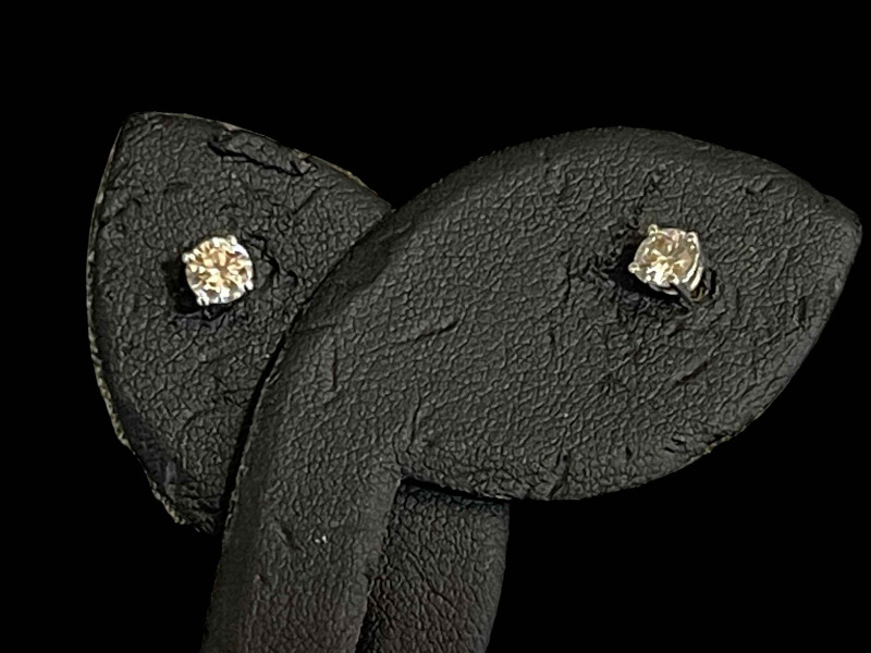 Pair diamond and 18 carat gold studs, each stone approx 0.25 carat.