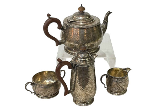 William Greenwood & Sons, Huddersfield, beaten silver four piece tea set,...