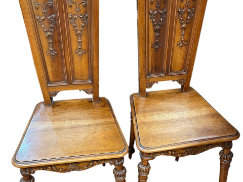 Pair Victorian mahogany carved panel back hall chairs.
