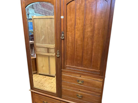 Victorian walnut combination wardrobe having cupboard door above two short...