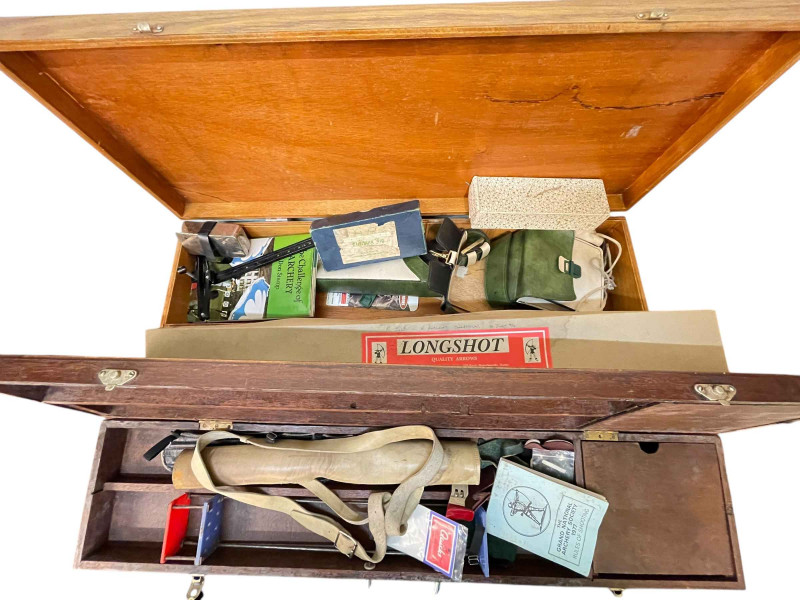 Collection of archery items including bow, two boxes of arrows, two wood cases and accessories.