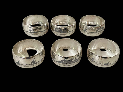 Set of six Egyptian silver napkin rings.