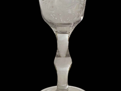 19th Century wine glass with etched bowl, knopped stem and folded foot.