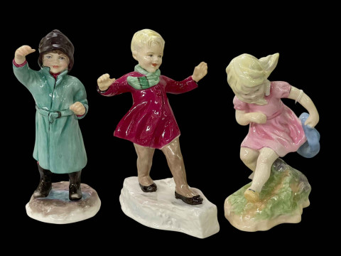 Three Royal Worcester figurines, January, February and March.