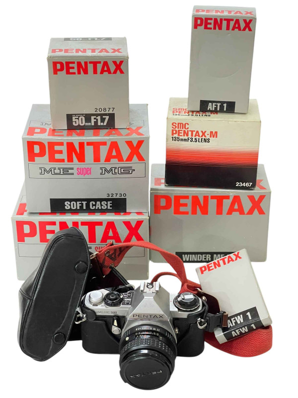 Pentax ME Super camera with accessories including 50mm FI.7 lens and 135mm F3-5 lens.